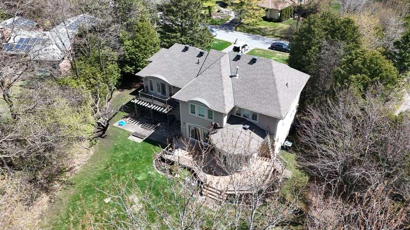 Overhead aerial of large residential property with circular deck